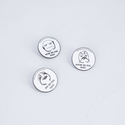 Three circular 9GAG x GRS pins with 3 monkeys faces, representing the ideology of Speak no evil, See no evil, and Hear no evil