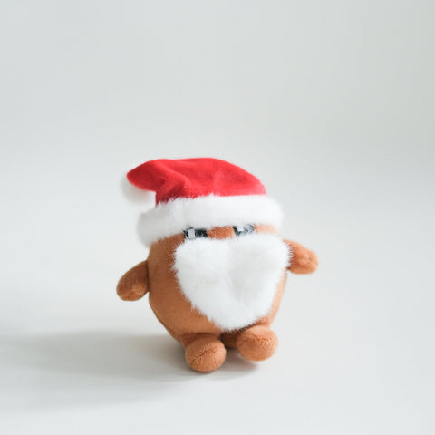 Small Potatoz plush wearing a Santa hat on a light gray background