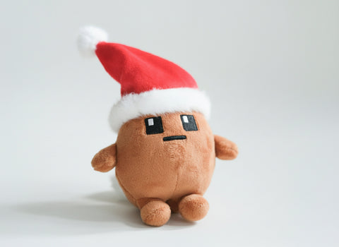 Potatoz plush toy with a Santa hat on a light gray background