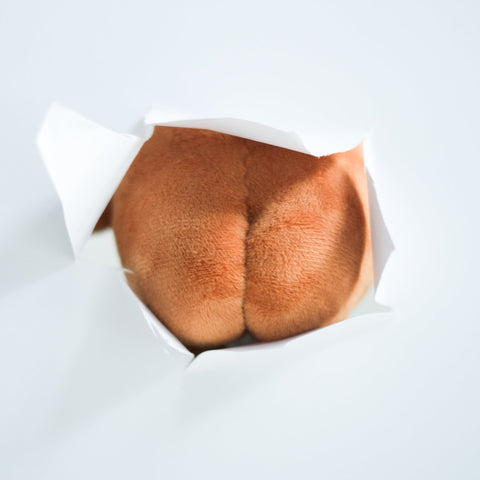Potatoz butt in a paper wrapper on a white background