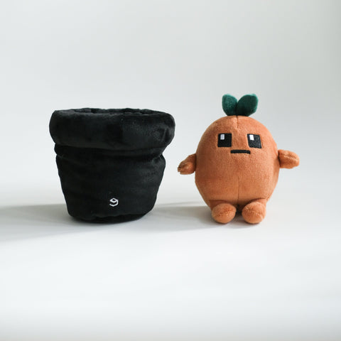 Potatoz plush toy resembling a cartoon-like potato with a black pouch on a white background