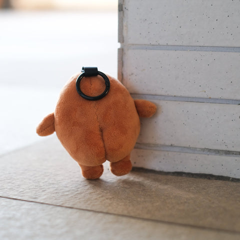 Potatoz plush toy on a light-colored floor.