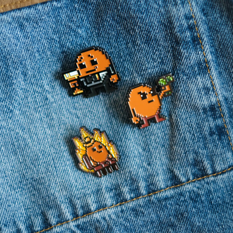 Potatoz cartoon-style pins on a blue denim fabric background